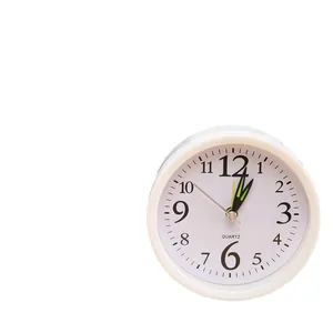 Minimalist white analog alarm clock with large black numerals for bedroom bedside