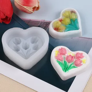 Detailed view of heart-shaped tulip bouquet silicone mold with finished scented plaster crafts.