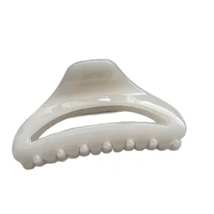 Minimalist creamy off-white shark hair claw clip for elegant everyday hairstyles