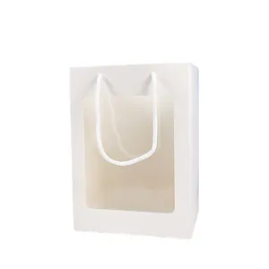 Elegante witte papieren cadeautas met groot transparant venster en stevige touwhandvatten
