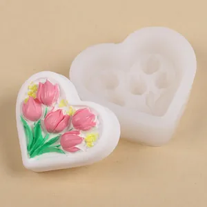 Detailed view of heart-shaped silicone mold and finished pink tulip flower bouquet soap