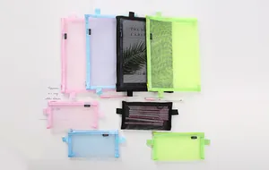 Display of various multi-colored translucent mesh pencil cases and A4 file organizers.