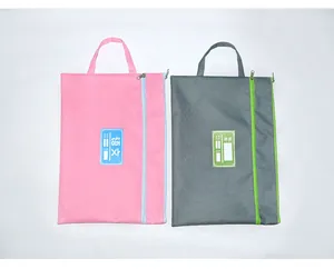 Two Oxford cloth A4 subject file bags in pink and grey with handles and identification labels