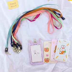 Assorted colorful lanyards with cute cartoon animal ID card holders for students.