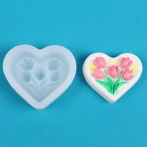 Detailed view of heart-shaped tulip silicone mold with finished plaster model for DIY crafts