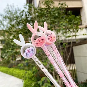 Close-up of cute rabbit-shaped gel pens with cherry blossom patterns and shakable sequins.