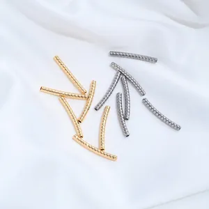 Macro view of stainless steel curved tubes with twisted snake pattern for jewelry making