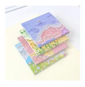 Close-up of four oil painting style sticky note pads with aesthetic scenery designs.