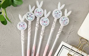 Detail of cute bunny gel pens with glitter sequins and cherry blossom patterns