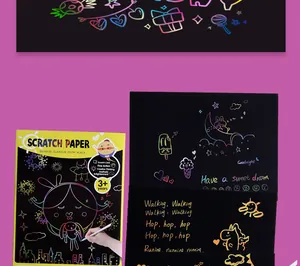 Detailed view of rainbow scratch art paper with colorful unicorn and star designs