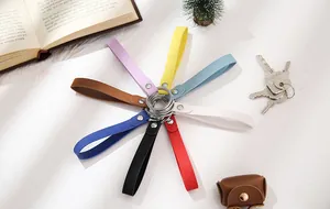 Detailed view of multiple colorful leather keychain straps arranged in a radial pattern