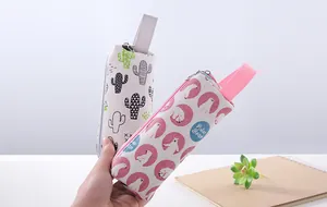Close-up of cute cartoon canvas pencil cases with cactus and polar bear patterns