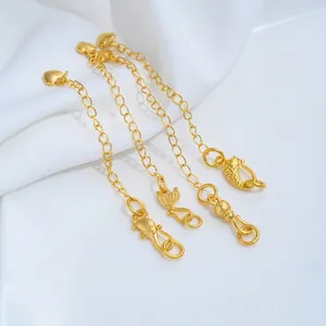 Detailed view of 24K gold plated jewelry extension chains with various animal charms