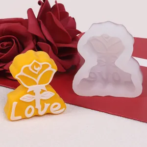Close-up of rose and 'Love' letter silicone mold for DIY aromatherapy candle making