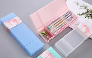 Multiple candy-colored PP pencil boxes showing storage capacity and internal dividers.