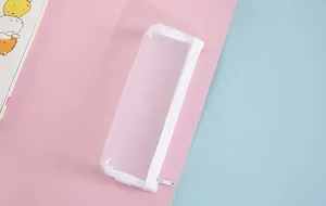 Close-up view of a white semi-transparent mesh pencil case on a colorful background