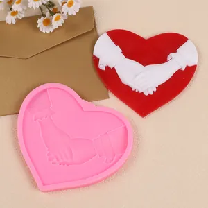 Pink heart silicone mold with romantic hand-holding design for DIY cake decoration