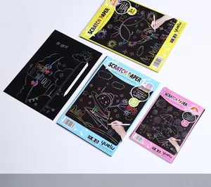 Variety of colorful scratch-off art paper notebooks for creative kids' drawing.