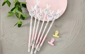 Detailed shot of creative pink rabbit gel pens with glitter sequins inside rabbit ear caps