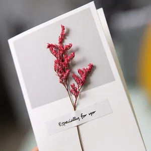 Elegant greeting card featuring a real dried flower and "Especially for you" label