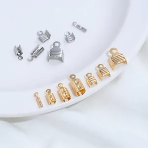 Detailed macro shot of various gold and silver stainless steel jewelry cord end crimps