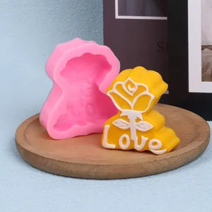 Detail view of rose 'Love' silicone mold with finished yellow wax candle