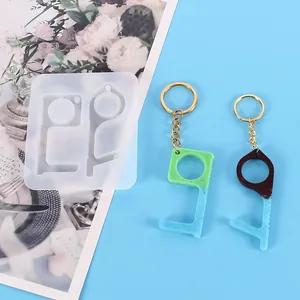 Detailed view of a silicone mold with finished DIY resin non-contact door opener keychains