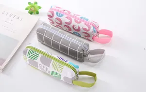 Three stylish canvas pencil cases with cartoon patterns and minimalist grid designs