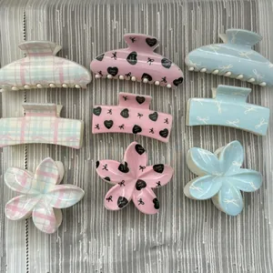 Collection of macaron heart and bow hair claws in floral and square shapes for sweet hairstyles
