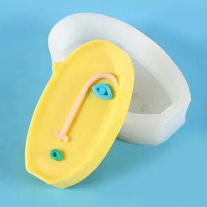 Detailed macro view showing an abstract face silicone mold for DIY handmade candle crafts