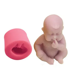 Detail view of baby-shaped silicone mold and finished lavender fondant figure for baking