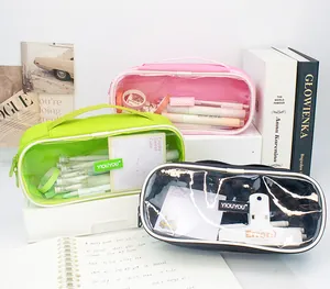 Close-up of three colorful large capacity canvas pencil cases with clear front windows