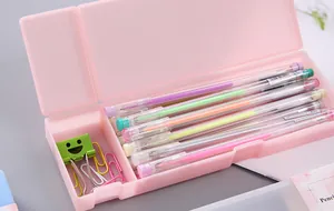 Detail shot of an open pink PP plastic pencil case filled with colorful stationery items