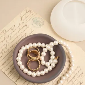 Close-up of irregular mini bowl silicone mold with finished jewelry storage dish