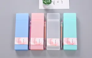 Close-up detail of four candy-colored PP plastic pencil boxes with artistic paper bands