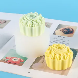 Detail of rose swirl silicone mold with green and yellow wax cupcake finished products