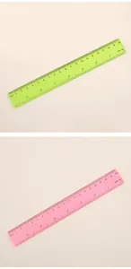 Detailed view of 20cm transparent plastic rulers in neon green and soft pink colors