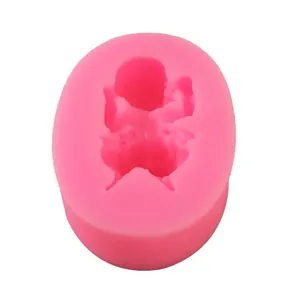 Detailed top view of a pink baby-shaped liquid silicone mold for DIY fondant cake baking