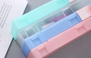 Macro view of candy-colored frosted PP stationery boxes in various pastel shades