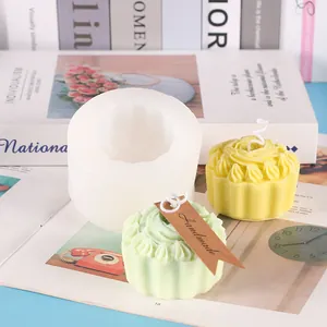 Detail view of rose cupcake silicone mold with finished green and yellow candles