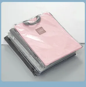 Stack of waterproof laptop document bags in various colors with handles
