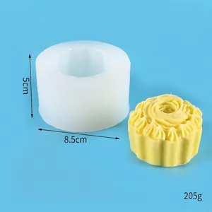 Detail view of rose cupcake silicone mold with 8.5x5cm dimensions and yellow sample candle