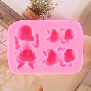 Close-up of pink liquid silicone fondant mold with cute baby shapes for DIY baking