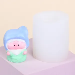 Detailed view of 3D gnome elf silicone mold and finished colorful resin figurine