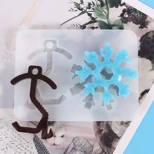 Detail view of silicone mold and resin snowflake for contactless door opener DIY.