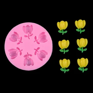 Detailed view of pink tulip flower silicone mold with finished yellow resin flower samples