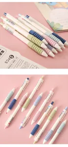 Close-up of pastel retractable gel pens with soft cloud-like textured grips on pink background