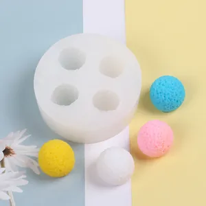 Detailed view of 4-cavity silicone mold with colorful textured berry shaped ice balls