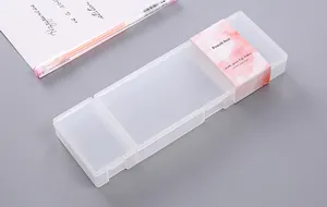 Detail view of a minimalist translucent PP pencil box featuring a decorative pink watercolor paper sleeve