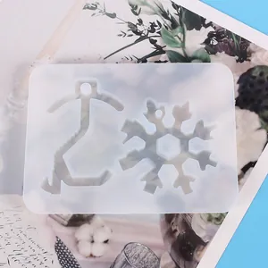 Clear silicone mold for resin casting with snowflake and door opener tool shapes